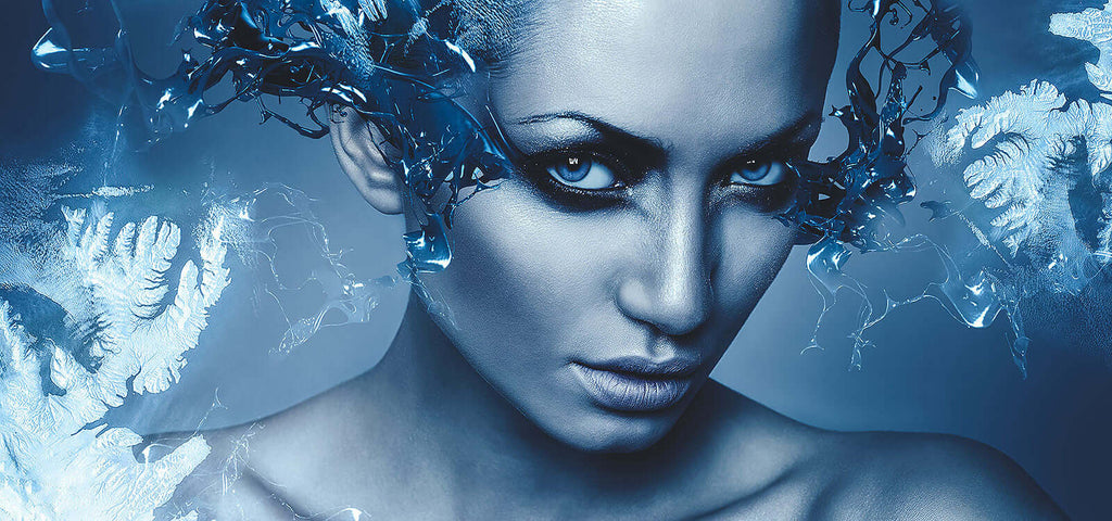 Blue-toned close-up of a woman with icy water effects symbolizing cool and heat sensations for Penchant Premium lubricant.