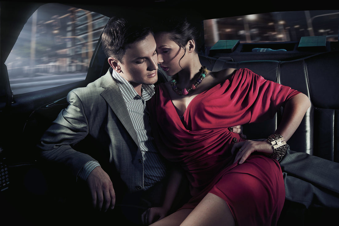 Couple embracing intimately inside a parked car at night, highlighting the theme of car sex.