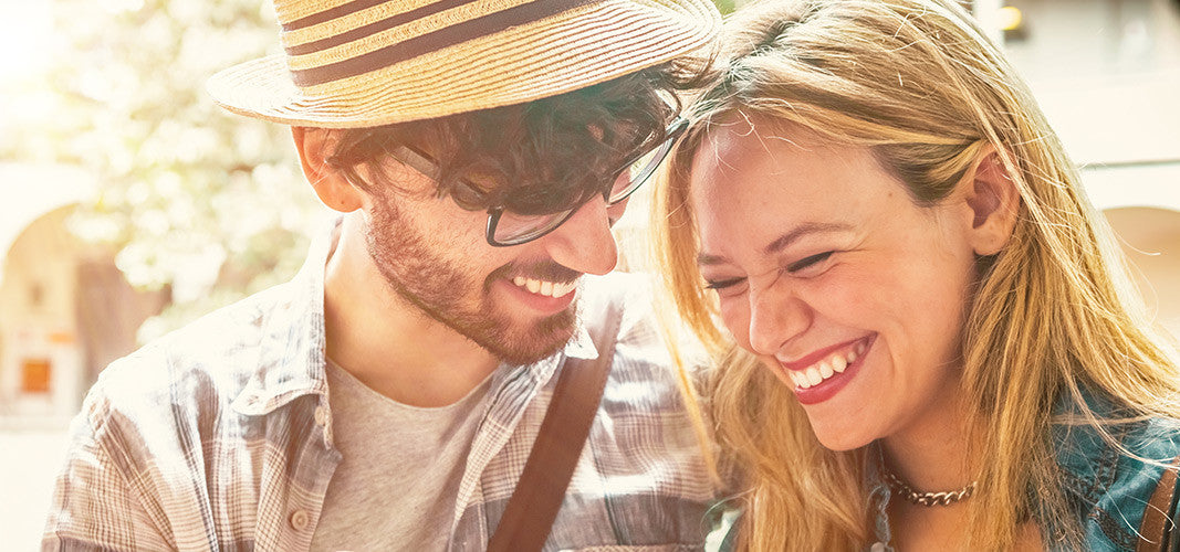Happy young couple enjoying outdoors smiling together concept of male birth control advancements