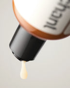 Penchant organic aloe based lubricant close-up macro shot of bottle cap with a drop of lubricant falling, lifestyle product photography